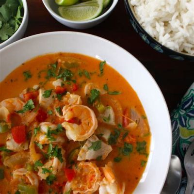  Moqueca! Un plat de poisson épicé et crémeux qui vous transportera au bord des eaux cristallines du Brésil.